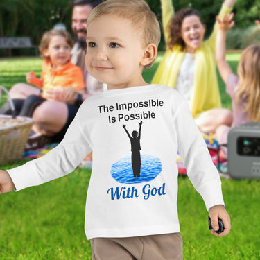 Rabbit Skins toddler long-sleeve t-shirt with “Impossible Toddler” design and faith-filled message, soft cotton, breathable and durable, Christian apparel for active toddlers and spiritual encouragement, toddler boy in white shirt